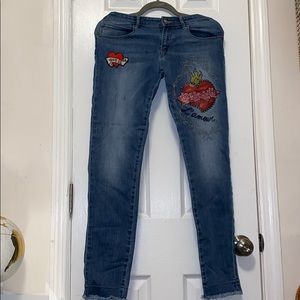 Guess blue jeans with designs